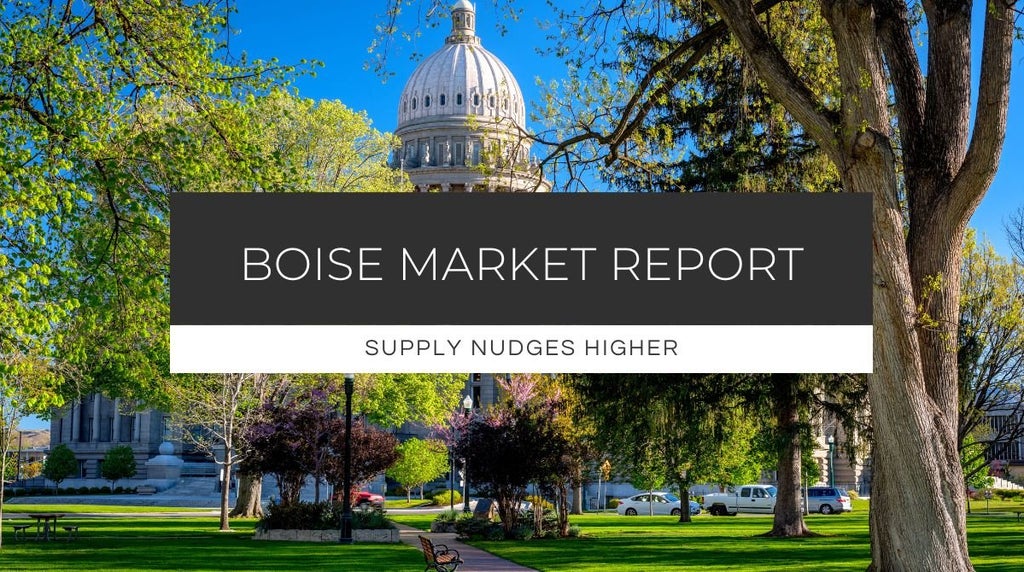 Idaho Capitol Building surrounded by spring foliage, representing local market conditions in Treasure Valley real estate.