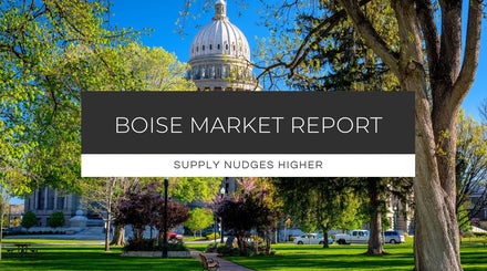 Idaho Capitol Building surrounded by spring foliage, representing local market conditions in Treasure Valley real estate.