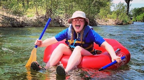 A rafter enjoying herself while floating the Boise River