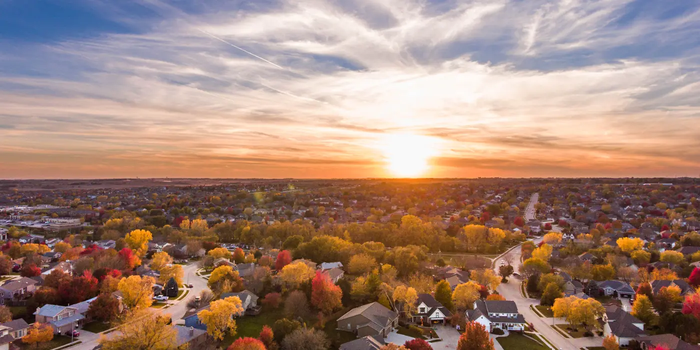 Aerial view of Ada County neighborhood at sunset highlighting tight housing supply and stable home prices despite rate hikes